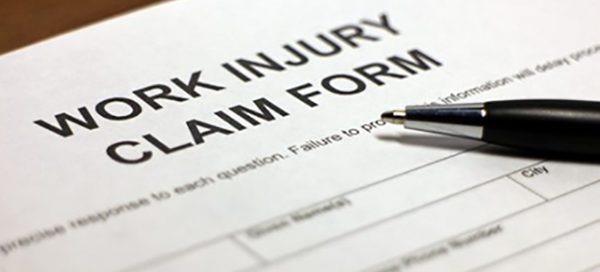 work injury claim form and pen