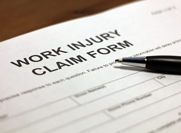 work injury claim form and pen