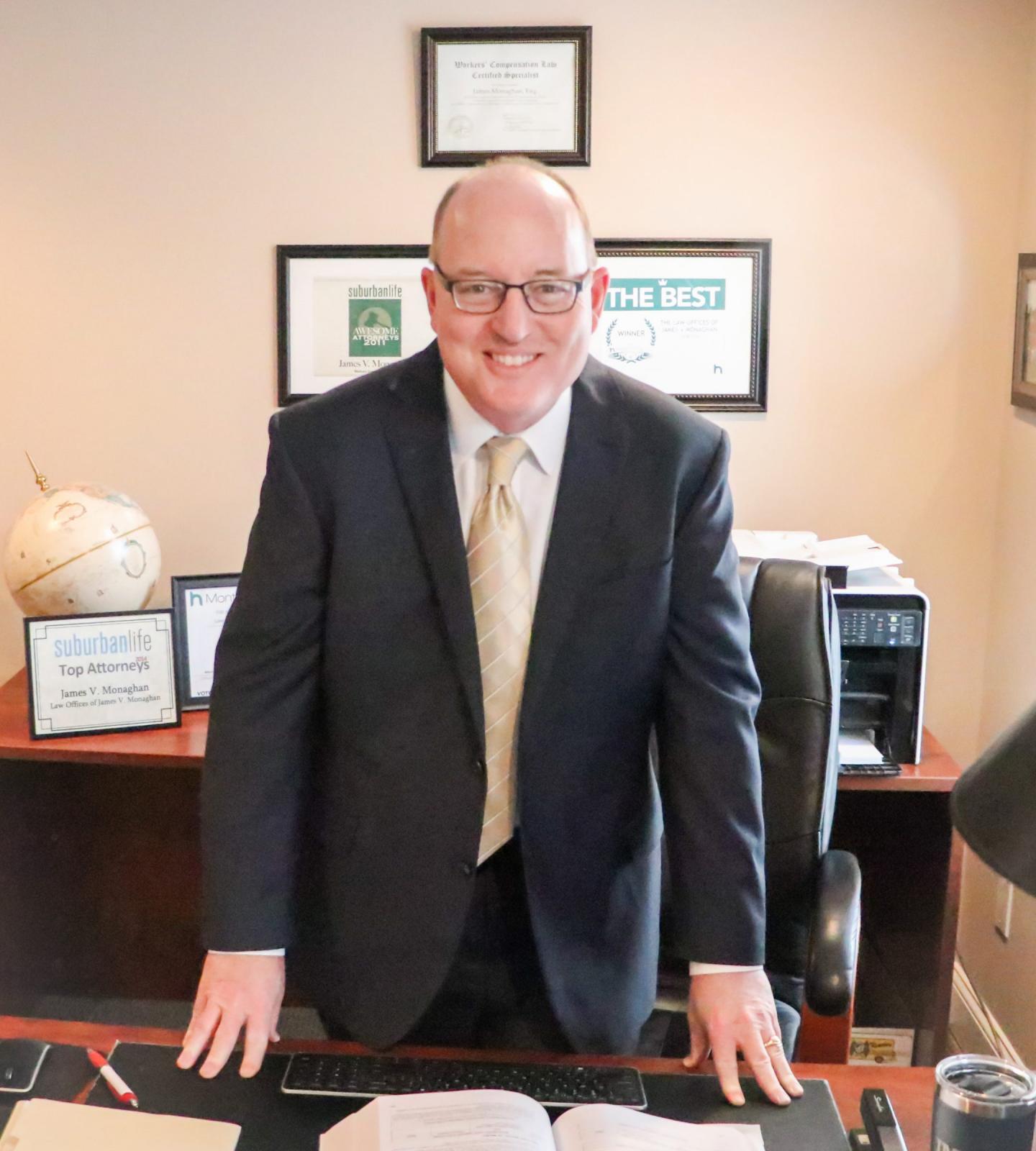 lawyer standing at desk in a suit