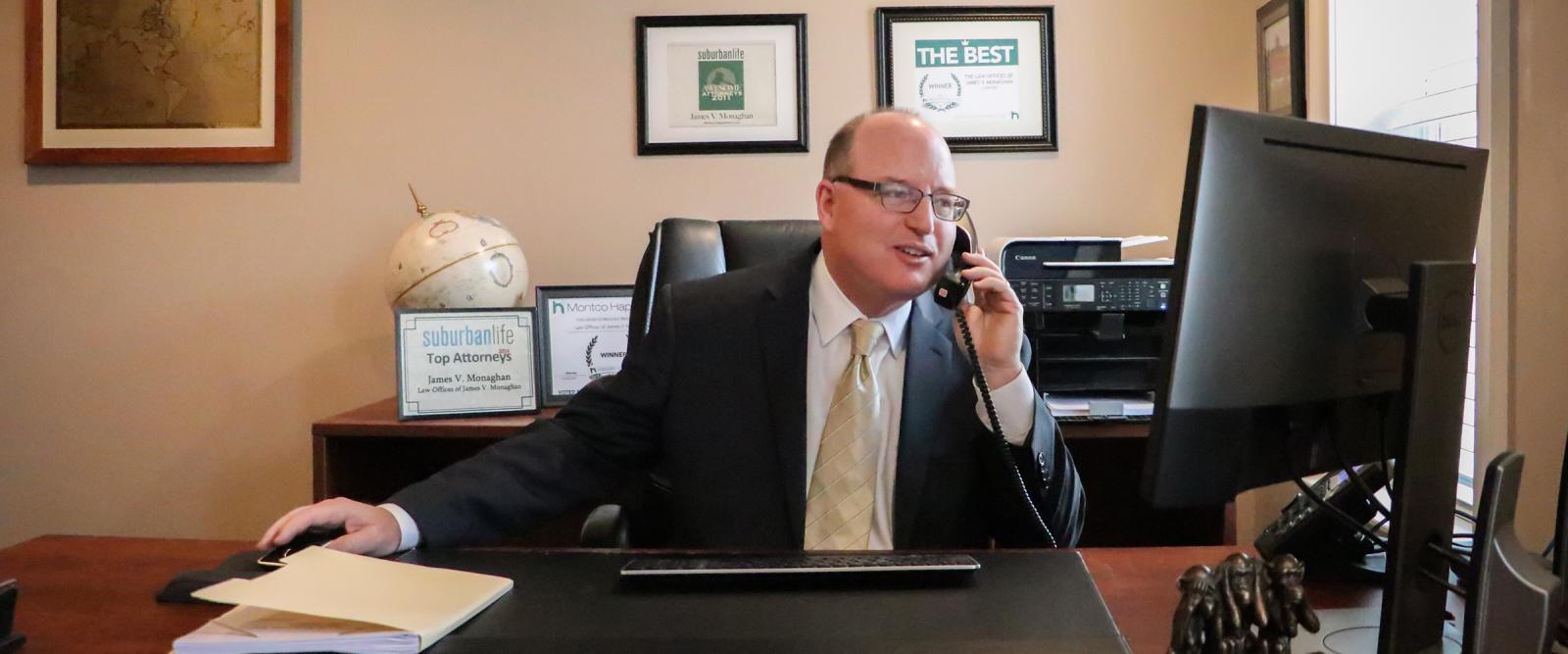 James V. Monaghan talking on phone in Norristown law office